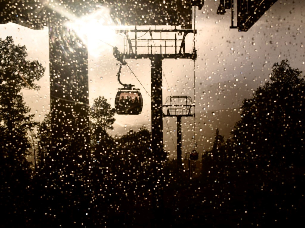 gondolas with the rain droplets on them, highlighted by the setting sun
