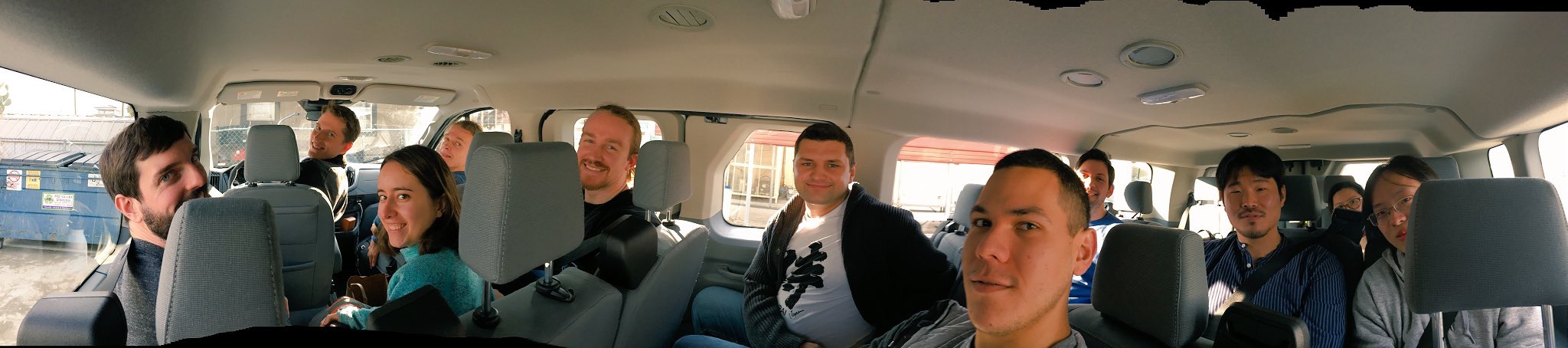 A panorama-selfie of Miller group in the van driving to the meeting together.